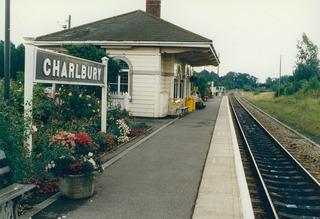 Network Rail is reinstating double track on much of the Cotswold Line rail route between Oxford and Worcester, which was singled in the early 1970s. Charlbury station's garden in bloom in July 1992 alongside the single track.