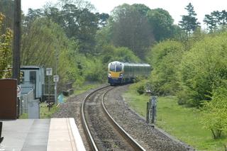 A First Great Western Adelante train approaches Charlbury on the single track on May 7, 2003, on a run to mark the 150th anniversary of the Cotswold Line's opening in 1853. Double track will soon extend for a mile beyond the platform towards Oxford.