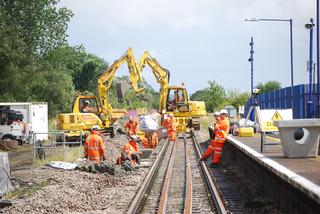 Network Rail is reinstating double track on much of the Cotswold Line rail route between Oxford and Worcester, which was singled in the early 1970s. Excavators at work at Ascott-under-Wychwood station in July 2009.