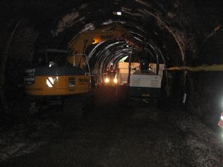 Network Rail is reinstating double track on much of the Cotswold Line between Oxford and Worcester. An excavator is seen at work clearing the old trackbed out of Chipping Campden tunnel, in Gloucestershire, in July 2009.