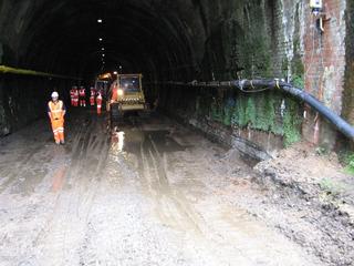 A soggy scene at the entrance to Chipping Campden tunnel, in Gloucestershire, in July 2009, with the old single track removed to allow renewal of the drains before new double track is laid.
