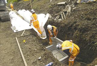 Engineers use old-fashioned muscle power to construct a drainage sump just outside Chipping Campden tunnel on July 28, 2009