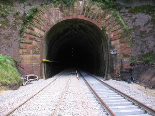 The first section of reinstated double track on the Cotswold Line emerges from the Mickleton portal at the north end of Chipping Campden tunnel in Gloucestershire in August 2009.