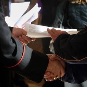 Cardinal Sean Brady gives out the pastoral letter to parishioners