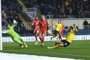 Matty Taylor slides in to score Oxford United's second goal against Wigan Athletic Picture: David Fleming