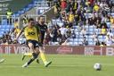 Kyle Joseph strokes home Oxford United's second goal against Burton Albion Picture: David Fleming