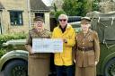 Group members Margaret Metcalfe (left) and Christine Salcombe hand over the cheque