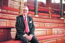 Dr Paul Coones, chairman of the curators, in the Sheldonian Theatre on one of the notoriously uncomfortable seats