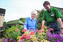 Resident Joyce Leonard with gardener John Haskell