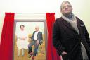 David Hockney with his portrait of Glyndebourne opera impresario Sir George Christie and his wife Mary, at the National Portrait Gallery, London