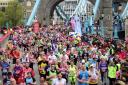 Challenge: London Marathon runners make their way over Tower Bridge during this year’s event