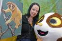 Campaign: Anna Nekaris with a painting of a loris that is to be sold in aid of the loris appeal, and the loris mascot