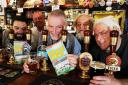 Doing it by the book: At the Royal Blenheim pub with the latest Camra Good Pub Guide 2016 are Tony Goulding, centre, from left, landlord Chris Davies, Dave Cogdell, Dennis Brown and Mick Hemmings