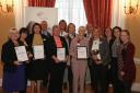 Well done: Orders of St John staff with their awards for their good work in care homes around the county