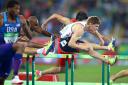 Lawrence Clarke on his way to third in the fifth heat of the 110m hurdles at the Rio Olympics last night Picture: Mike Egerton/PA Wire