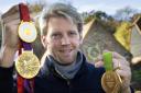 WHAT A CAREER: Andy Triggs Hodge with the Olympic gold medals he won at Beijing, London and Rio before retirement           Picture: Damian Halliwell