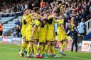 Oxford United's players celebrate Agon Mehmeti putting them 4-1 up at Peterborough United Pictures: David Horn