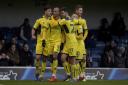 Wes Thomas (No 9) is congratulated after equalising for Oxford United  Picture: David Fleming