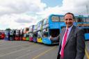 Oxford Bus Company managing director Phil Southall with the company's brightly coloured buses. Picture Jon Lewis