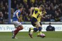 Rob Dickie (right) was pushed over for Oxford United's penalty  Picture: David Fleming