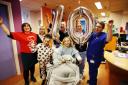 Oxford Children's Hospital patients Rose Breach, eight, from Old Windsor (in the wheelchair), and Leila-Rae Budini from Oxford. They are pictured with, from left, Sarah Vaccari of Oxford Children’s Hospital Charity, ward housekeeper Jacqui