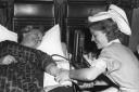 Teacher Pat Horseman, of Cumnor Hill, gives blood in 1959 with the help of ex-pupil Janet Hiatt, from Rose Hill