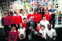Pupils from Cutteslowe Primary School with children’s author Michael Dahl, front, centre, and Raintree Publishing staff
