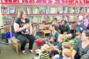 Volunteer Louise Castle, left, with mums and kids at a rhyme time event in Wantage Library