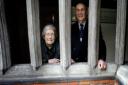 Resident Jean Pearce and  the Master of Christ's Hospital, Geoffrey Morris, in the almshouse cloisters