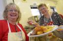Christmas cracker: Volunteers Margaret Ansell and Jackie Warner help to serve up a festive treat for the Over-60s Club at Seacourt Hall