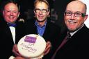 Pictured with the birthday cake at the party are, from left, Ian Hudspeth, Chris Baylis and Iain Nicholson