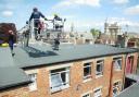 Oxfordshire firefighters use a hydraulic platform to try to rescue a pigeon from behind Boswells on Broad Street, May 1, 2009. Picture: Andy Eddy