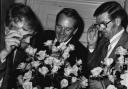The Mattock brothers, left to right, Robert, John and Mark, with a new rose, named Benson and Hedges Gold, which they exhibited for the first time at the 1979 Chelsea Flower Show