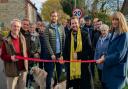 Cllr Tim Bearder cuts the ribbon to unveil the new 20mph limit in Cuxham