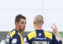 Josh Payne is congratulated by Oxford skipper James Constable after his superb free-kick on Saturday