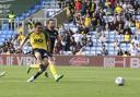 Kyle Joseph strokes home Oxford United's second goal against Burton Albion Picture: David Fleming