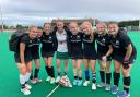 Susannah Townsend (in white) with the victorious Witney players. Picture: Witney Hockey Club