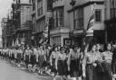 Girl Guides, Brownies and Rangers parade in High Street, Oxford, in 1962