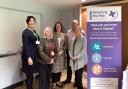 Victoria Prentis (centre) with the team at at Reducing the Risk of Domestic Abuse