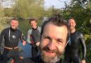 Kit Yates open-water swimming with a group on the River Thames