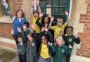 Headteacher Mandy Hook with pupils outside Wolvercote Primary School