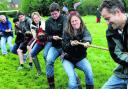 Sarah Martin, front, leads her tug of war team at Aristotle Lane   Picture: OX52206 Ric Mellis
