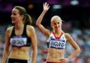 Hannah England salutes the fans after reaching the 1,500m semi-final
