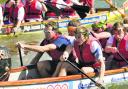 Silver medalists Richard, left, and Peter Chambers, right front, joined the competitors with paddles