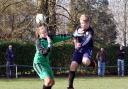 Cumnor’s Dominic Taylor rises to pop the ball over the head of Grove Challengers’ goalkeeper Ally Paton
