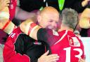 London Welsh skipper Tom May hugs head coach Justin Burnell after their success at Bristol on Wednesday night which secured promotion back into the Aviva Premiership