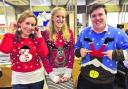 Keeley Rogers, Naomi Herring and Luke Sproule with festive knitwear