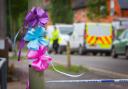 Tributes: Brightly-coloured ribbons tied to a lamp post in the town