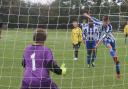 Headington Under 12s keeper Aiden Jackson saves a penalty from St Edmunds' Josh Richardson in his side's 19-0 defeat
