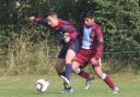 Marston Saints’ Dylan Thagie holds Quarry Rovers’ Umair Yousef at bay during the 1-1 draw at Marston in the Under 15 C League           Picture: Steve Wheeler